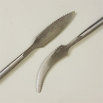 FORGED METAL MODELLING TOOL SPEAR WITH UPTURN
